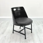 Chaise tonneau métal rembourrée design industriel vue de face